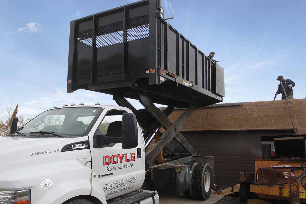 Doyle employee work on a roof