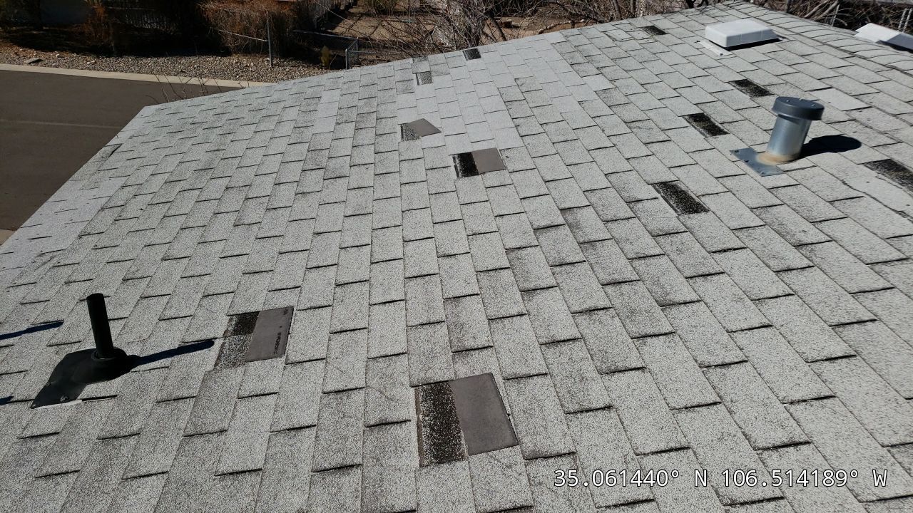 wind and hail damage on shingle roof